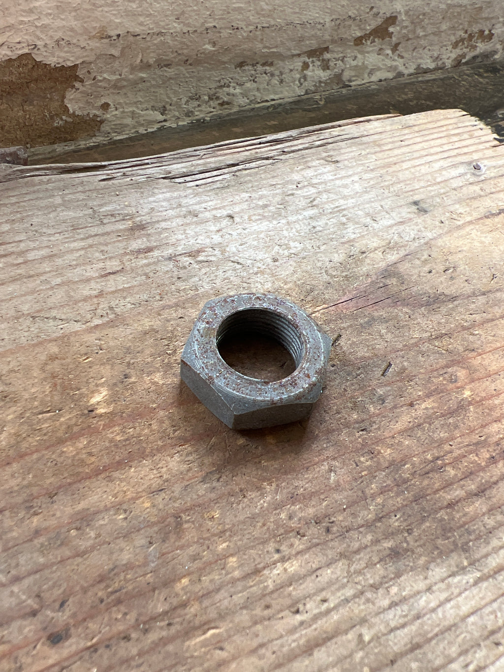 Triumph 350/500 unit front brake plate spindle nut NOS