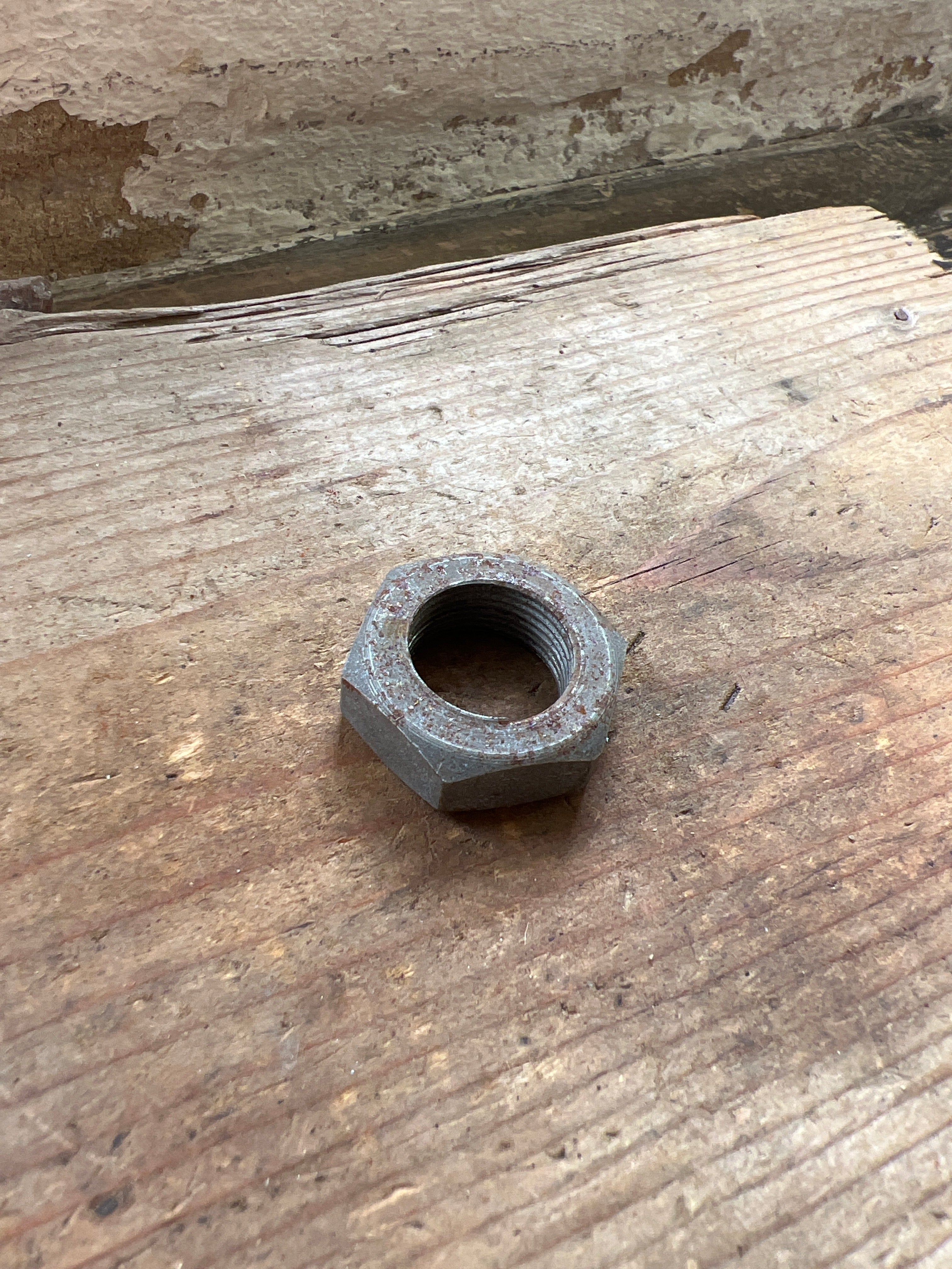 Triumph 350/500 unit front brake plate spindle nut NOS
