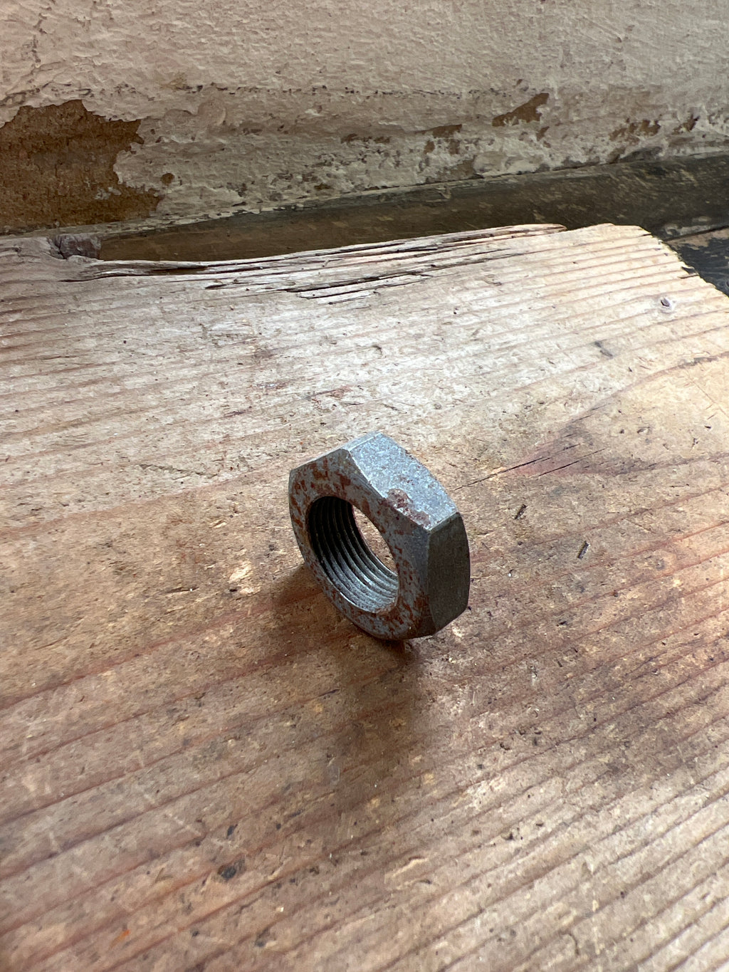 Triumph 350/500 unit front brake plate spindle nut NOS