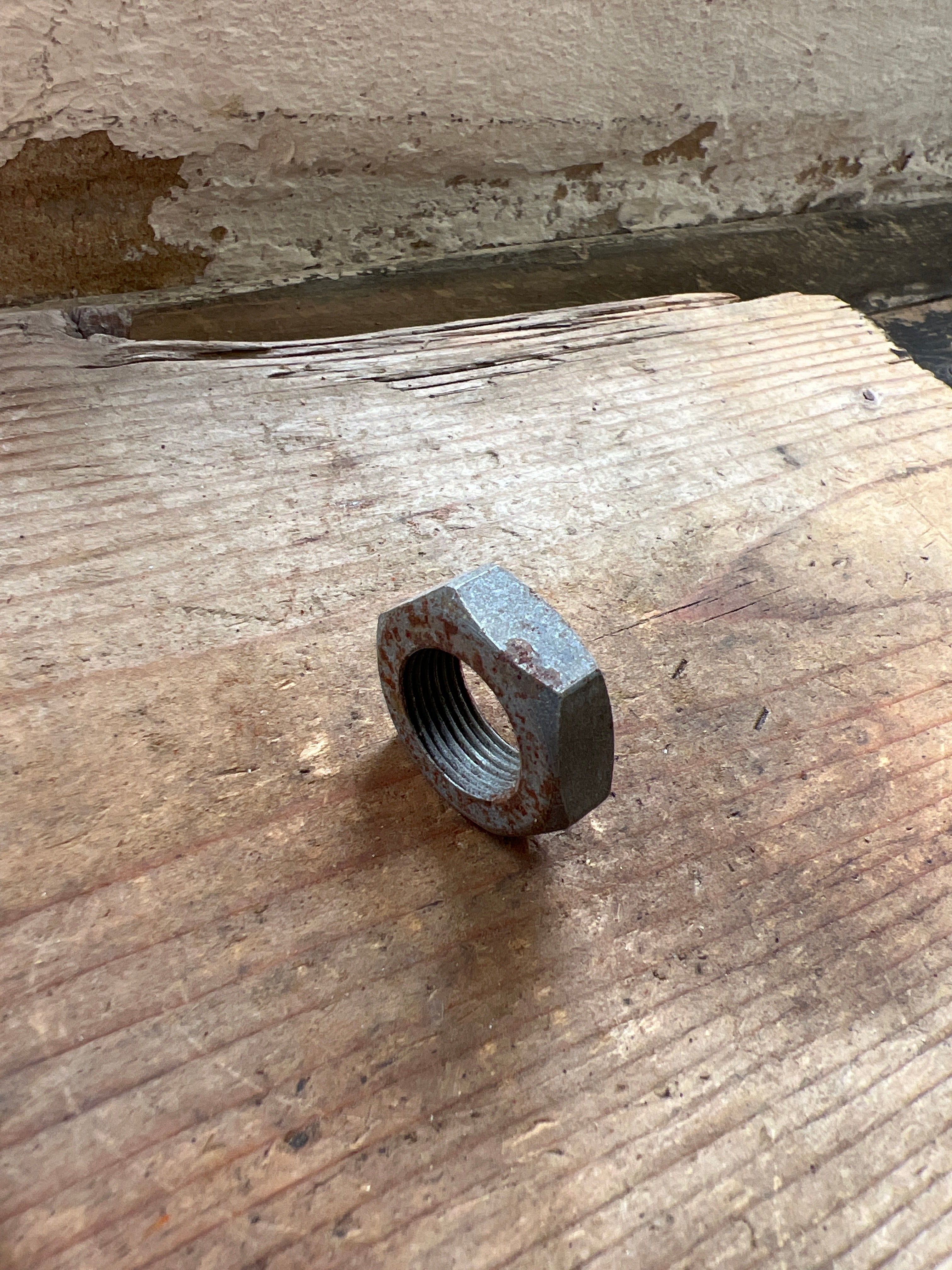 Triumph 350/500 unit front brake plate spindle nut NOS