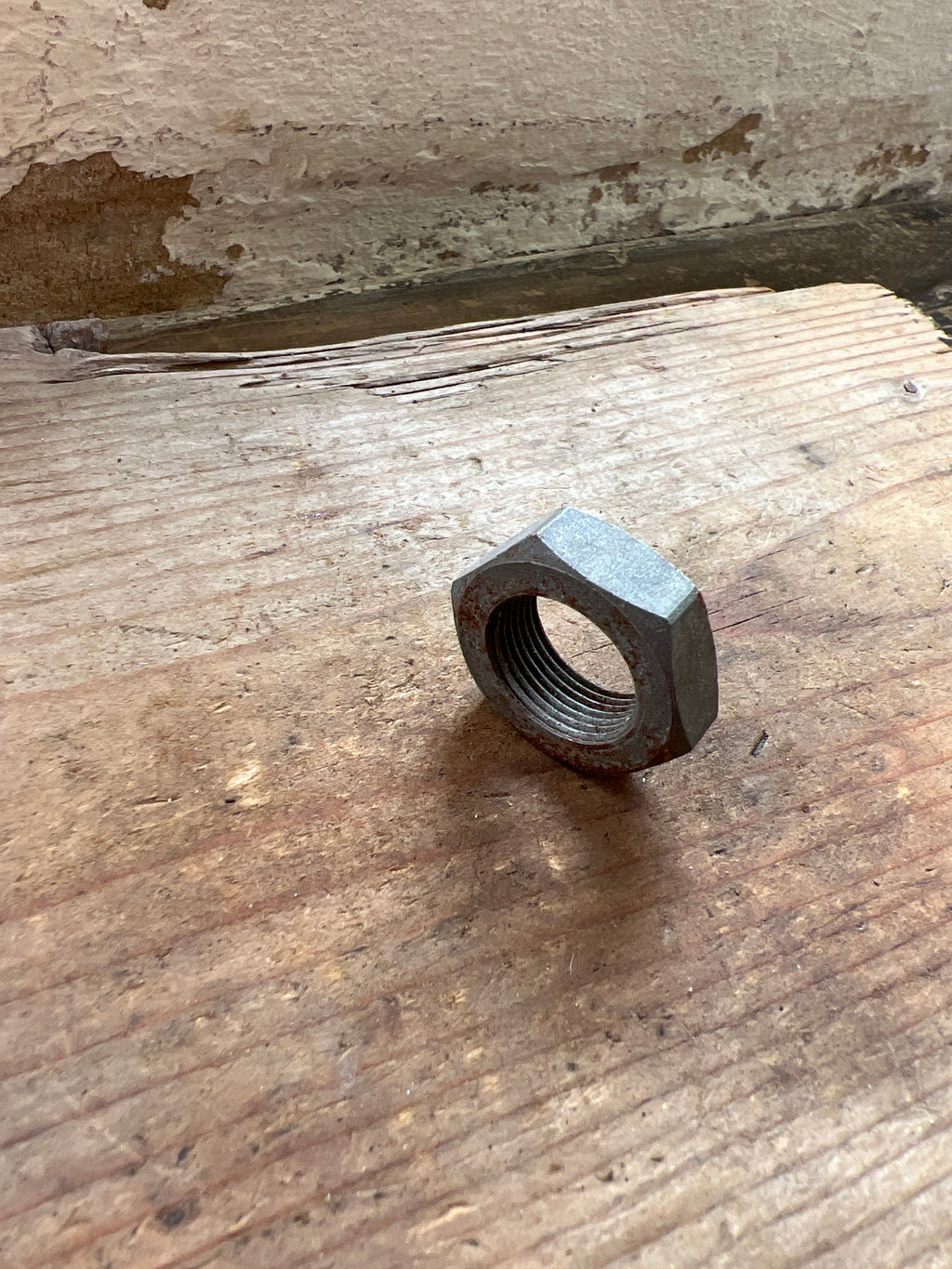 Triumph 350/500 unit front brake plate spindle nut NOS