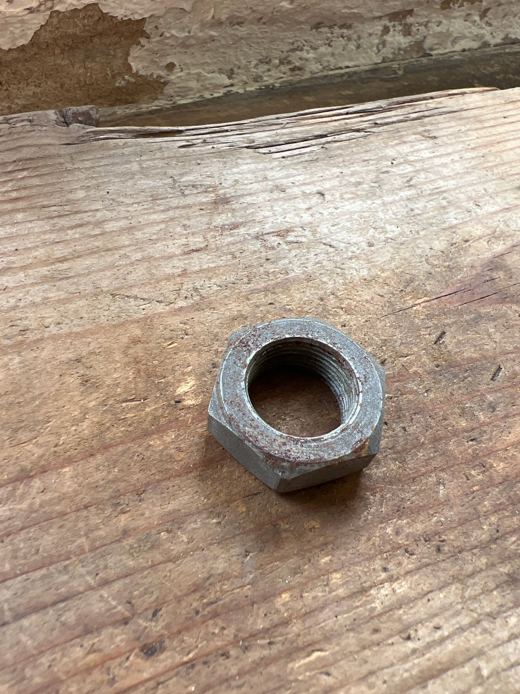 Triumph 350/500 unit front brake plate spindle nut NOS